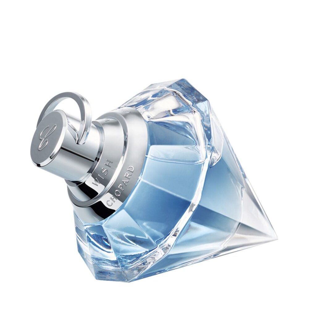 Diamantvormige glazen fles met lichtblauwe parfum, schuin, met zilveren dop.