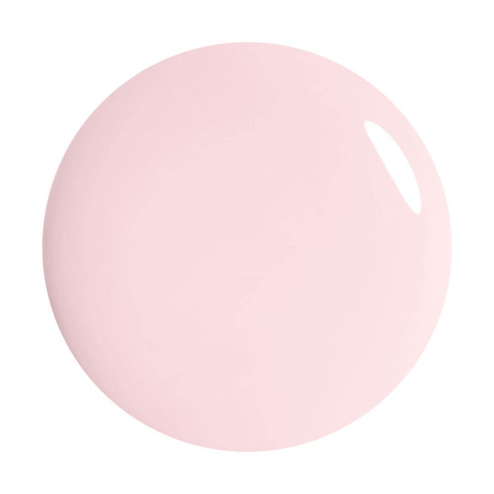 Goutte de vernis à ongles rose sur fond blanc. Forme ronde, surface brillante.