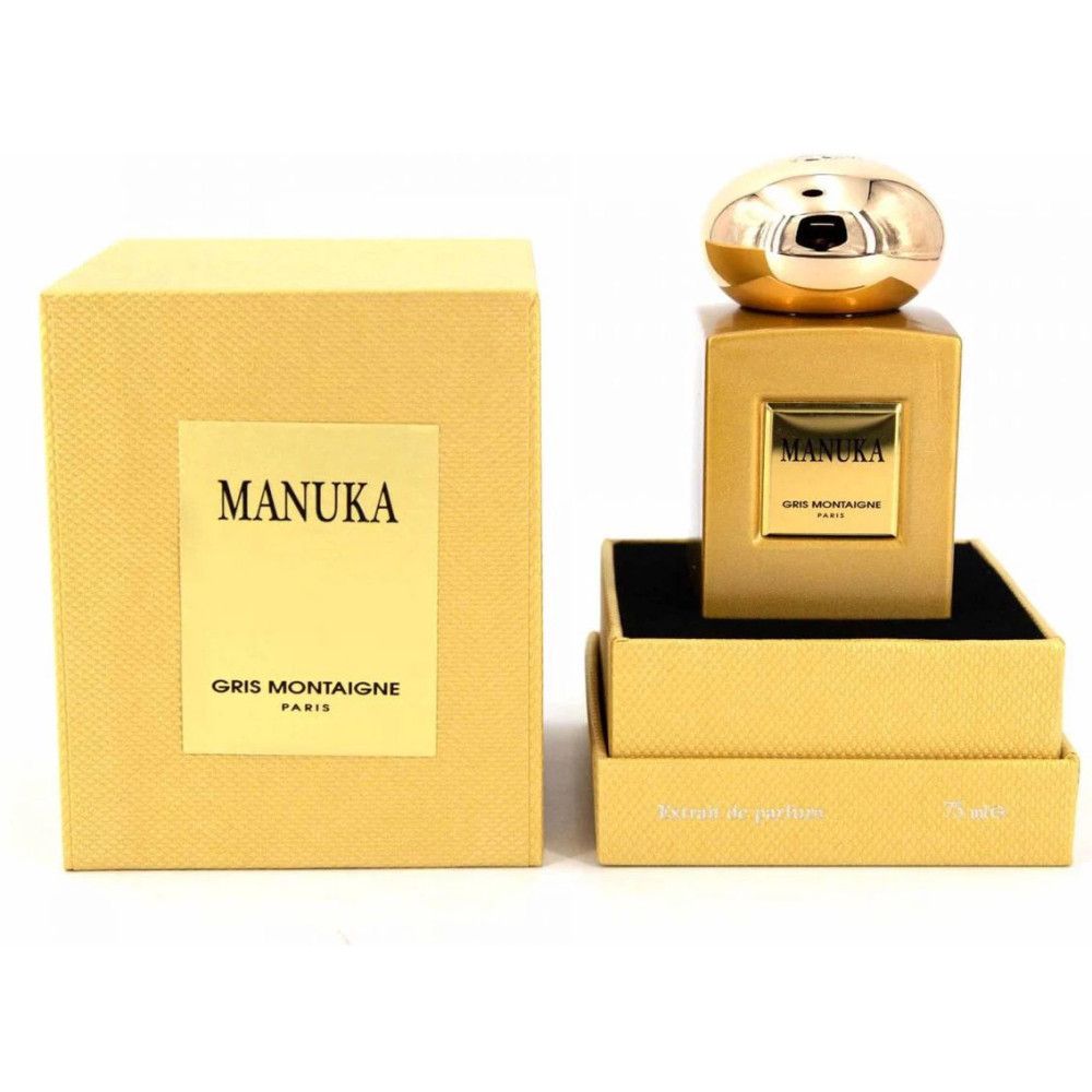 Goudkleurige flacon en verpakking. Opschrift MANUKA en GRIS MONTAIGNE PARIS.