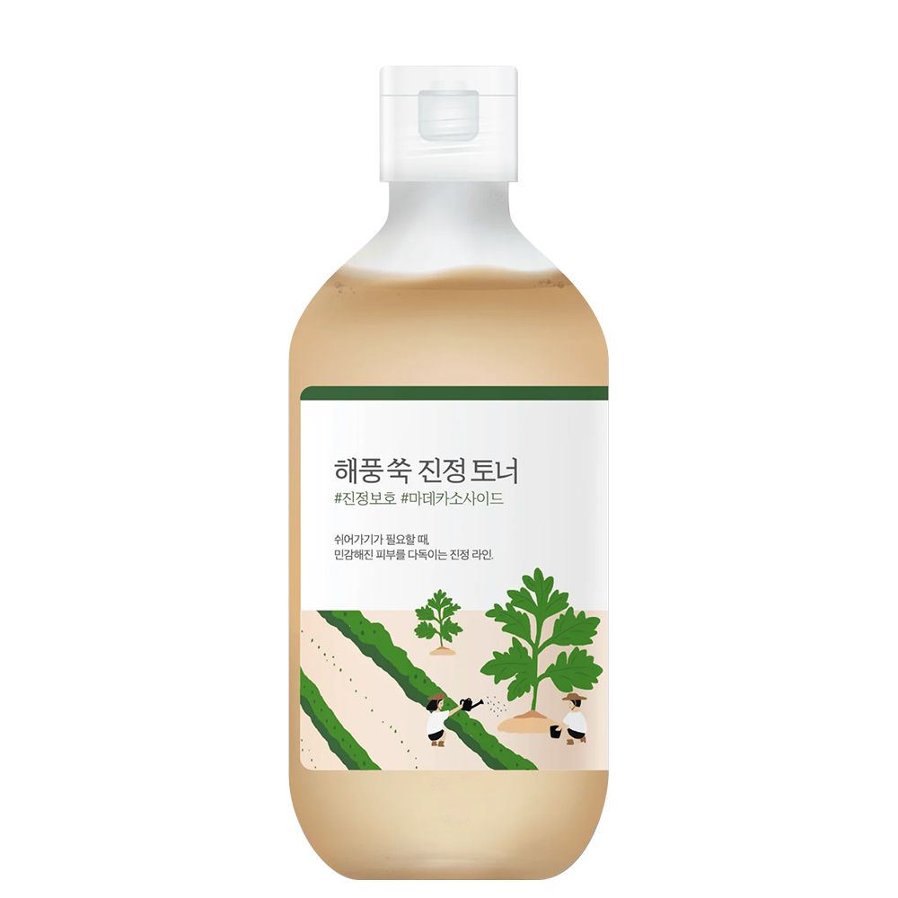 Fles ROUND LAB Mugwort Calming Toner met etiket en groene plantenmotieven.