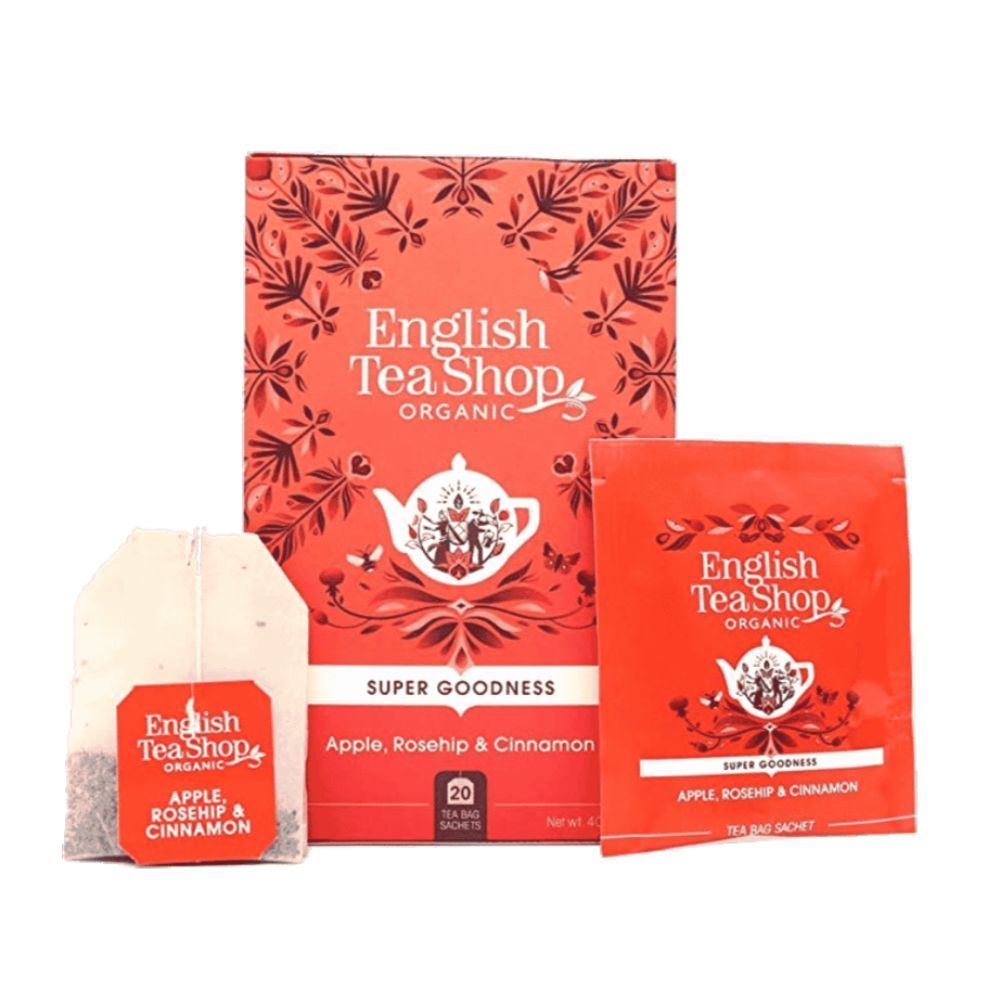 Verpakking met theezakje en individuele verpakking. Tekst "English Tea Shop Organic" en "Apple, Rosehip & Cinnamon".