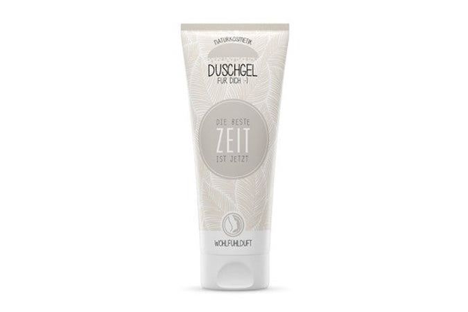 Tube de gel douche avec motif floral. Texte : "Duschgel für dich", "Die beste Zeit ist jetzt". Logo : Wohlfühlduft.