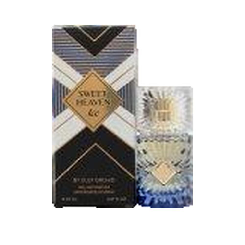 Flacon de parfum et emballage. Flacon avec bouchon doré et base bleue. Emballage avec motif géométrique et texte.