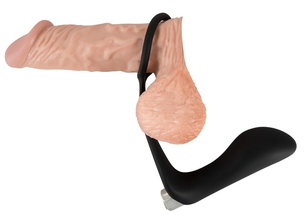 Pénis et testicules avec anneau pénien noir. Partie annulaire autour du pénis, tige sous les testicules.