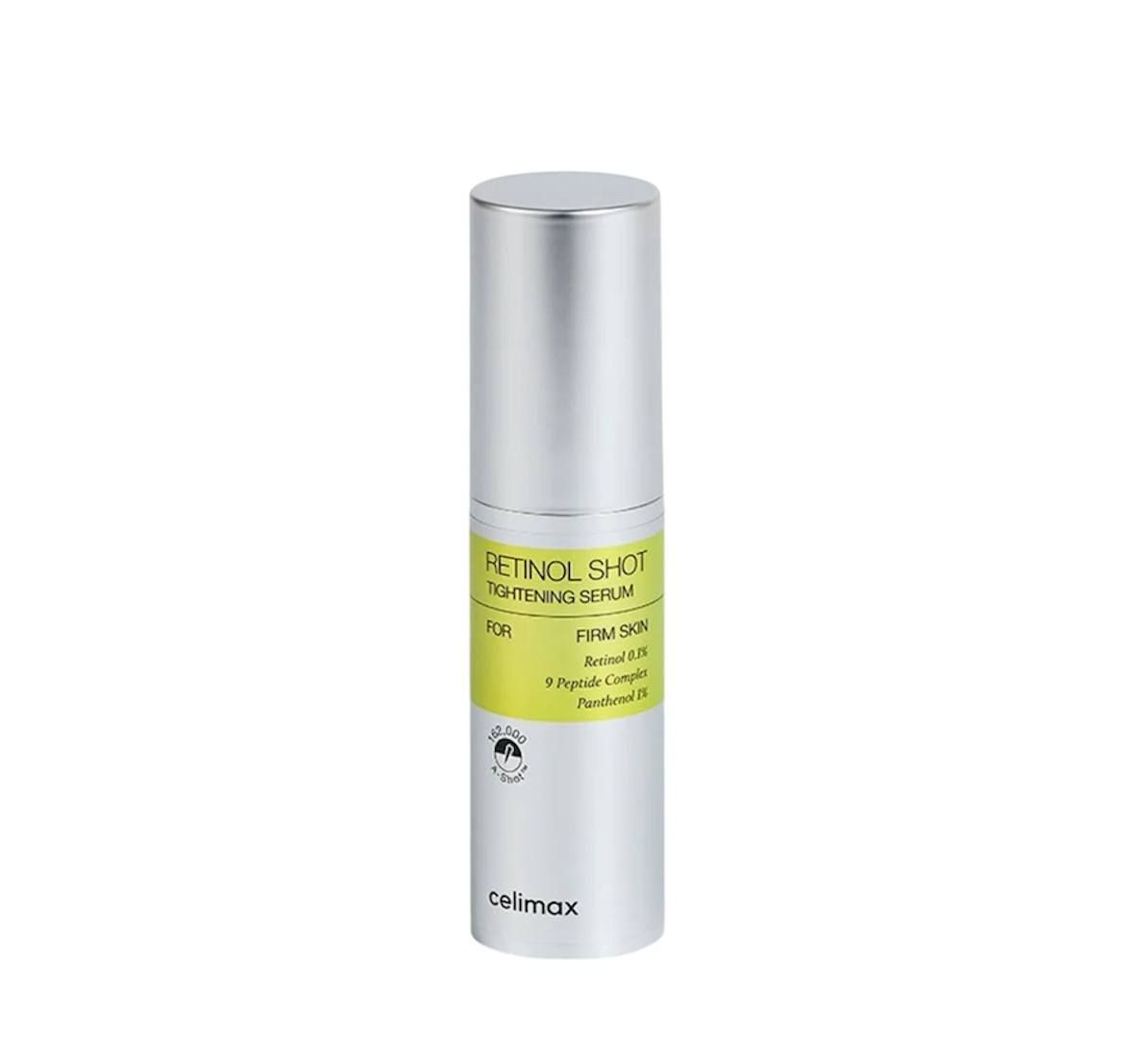 Flacon cylindrique argenté avec étiquette jaune. Inscription : Retinol Shot Tightening Serum, Celimax.