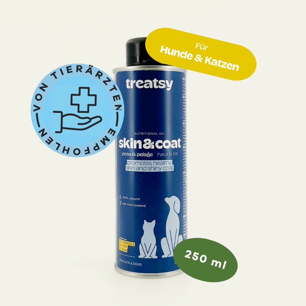 Blauwe bus met zwarte deksel. Opschrift: Treatsy, Skin & Coat. Tekst: Voor honden & katten. 250 ml.