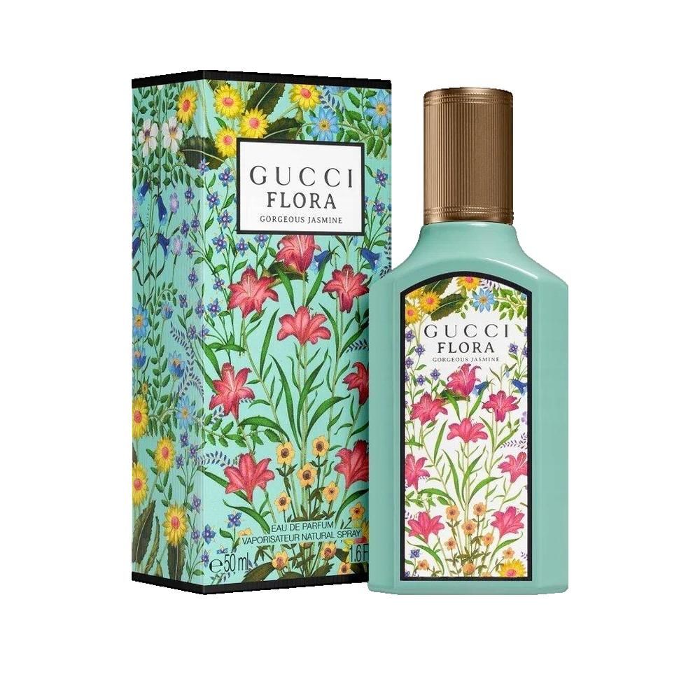 Flacon turquoise et boîte à motifs floraux. Inscription Gucci Flora Gorgeous Jasmine. Bouchon doré.
