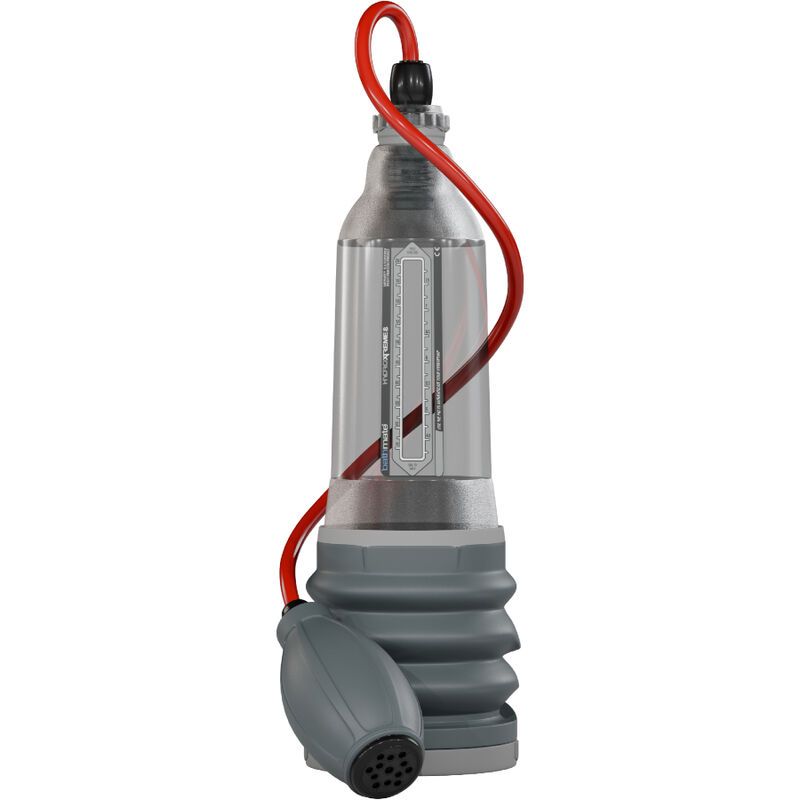 Pompe à pénis avec cylindre transparent, échelle de mesure et pompe à soufflet manuelle. Tuyau rouge reliant le cylindre et la pompe.