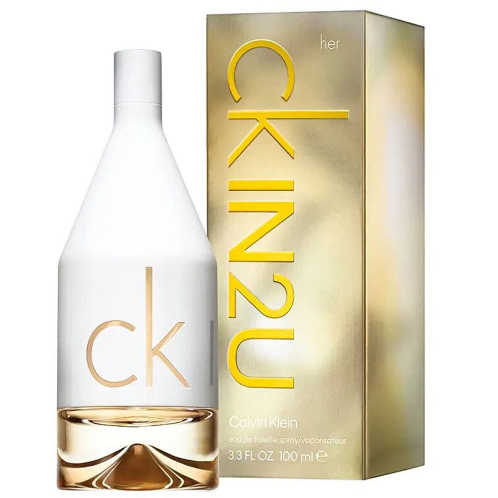 Parfumfles en doos. Witte fles, gouden belettering. Gouden doos met opschrift CK IN2U.
