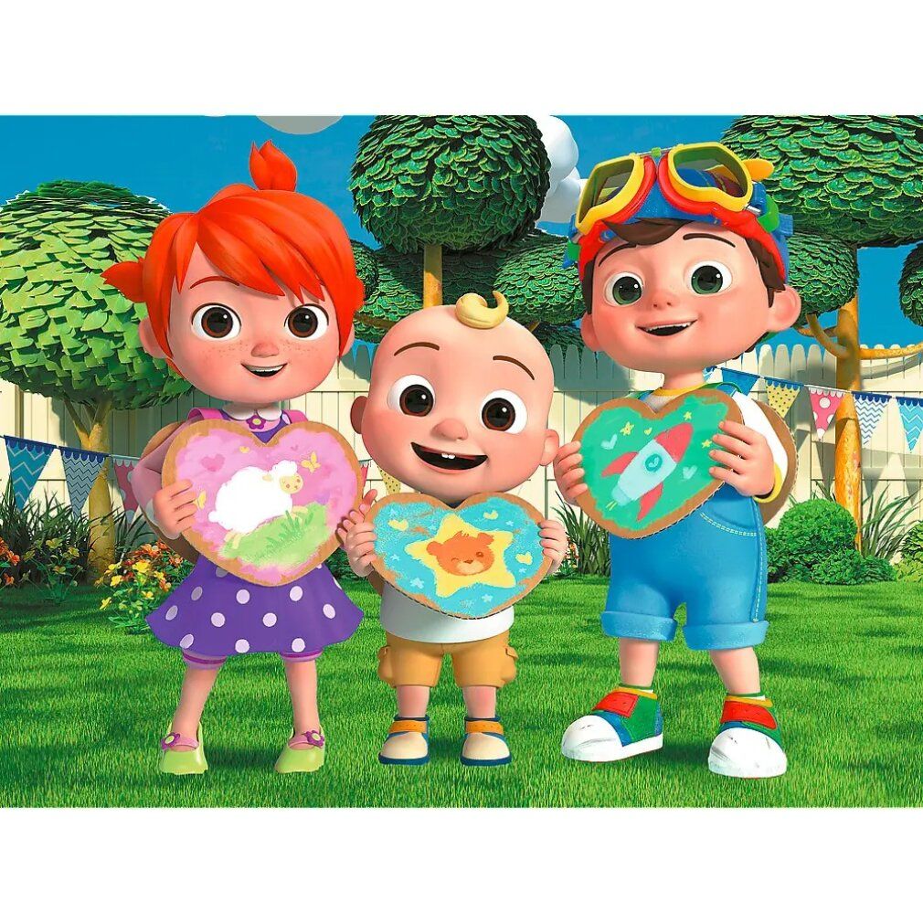 Drie Cocomelon-personages houden hartvormige puzzelstukjes vast. Achtergrond: groen gras, bomen en een hek. Personages dragen kleding.