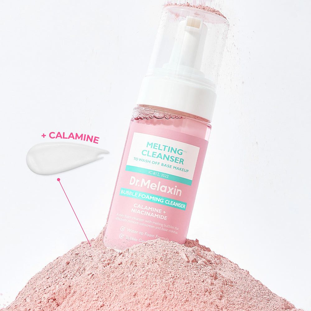 Nettoyant moussant Dr. Melaxin avec goutte de calamine sur poudre rose.