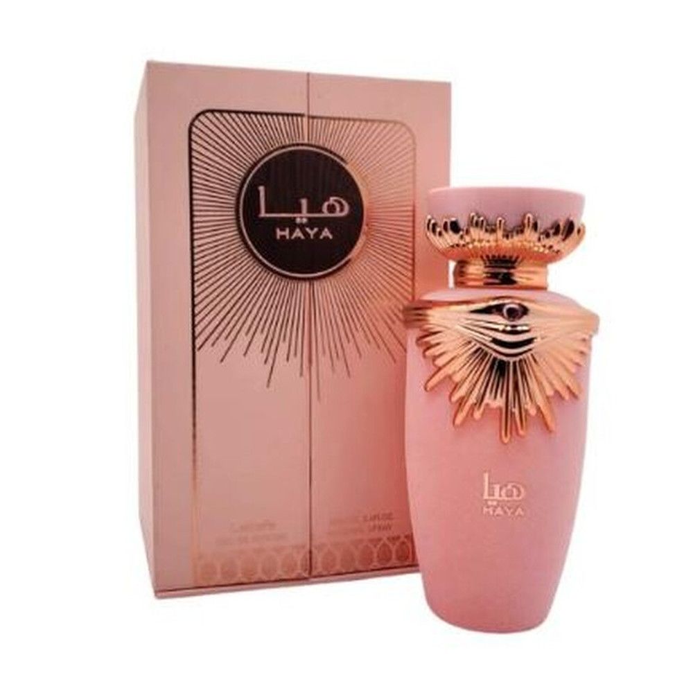 Flacon rose avec ornements dorés et emballage. Inscription "Haya".