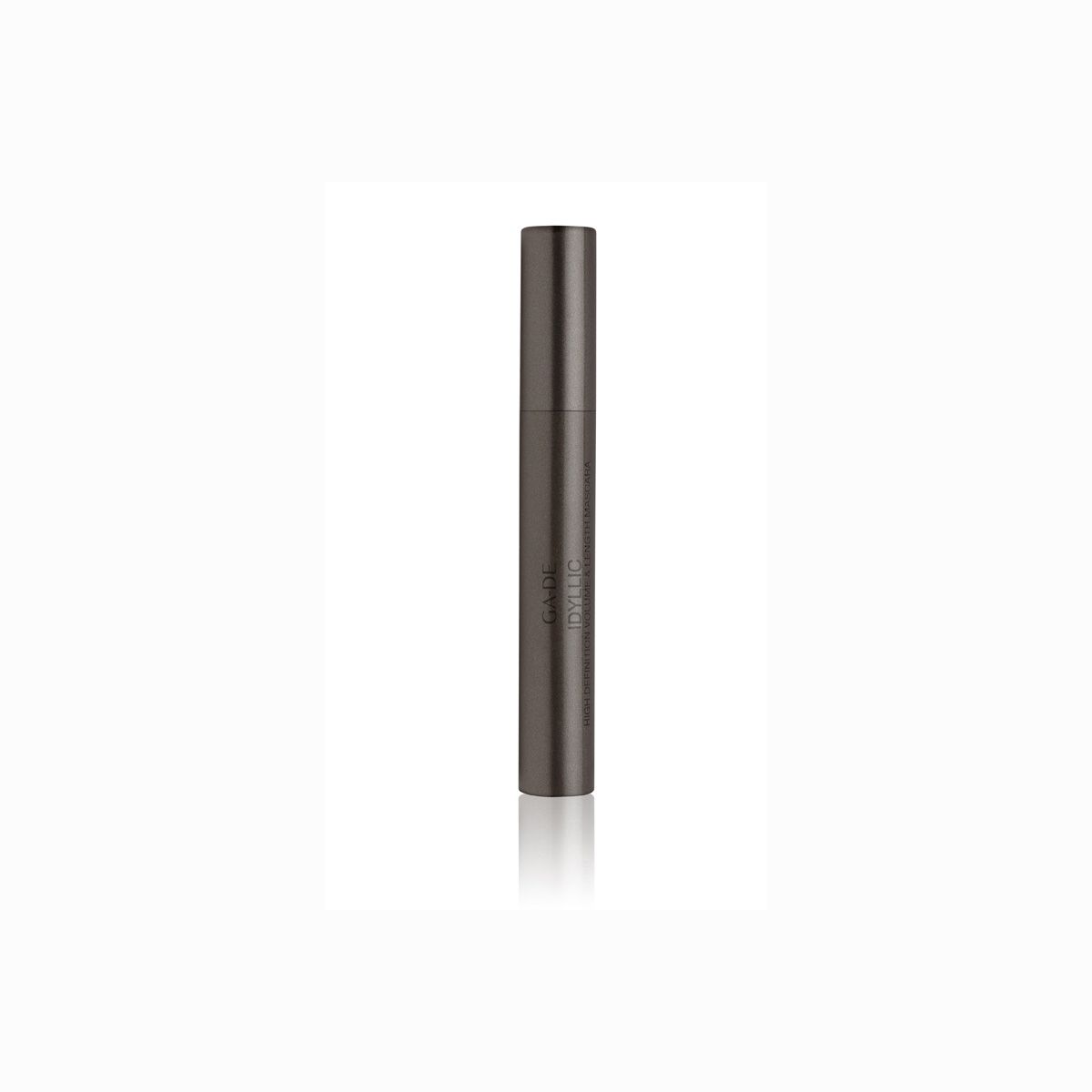 Tube de mascara cylindrique gris foncé. Inscription verticale.
