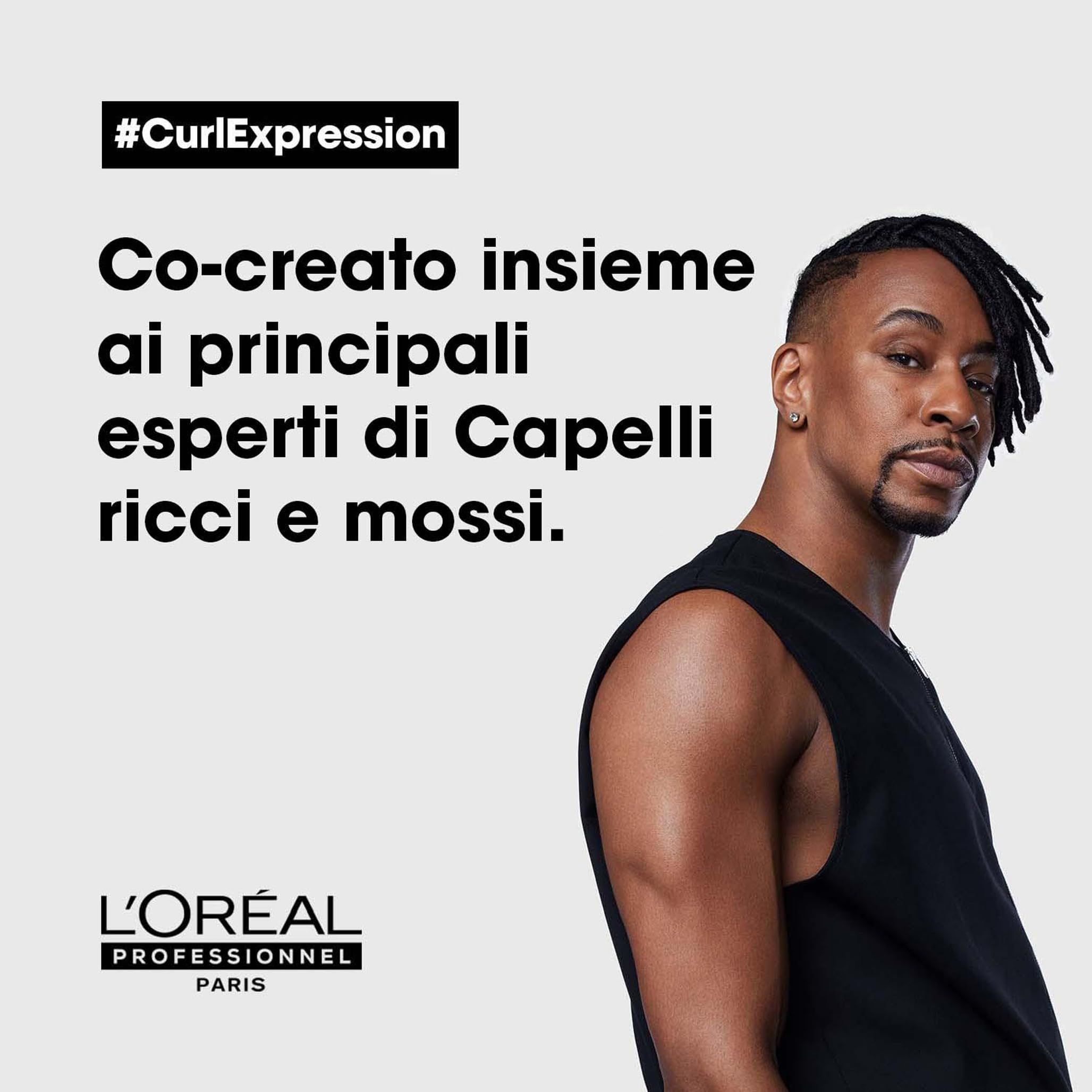 Man met artistieke dreadlocks en L'Oréal Professionnel Paris logo, die co-creatie benadrukt.