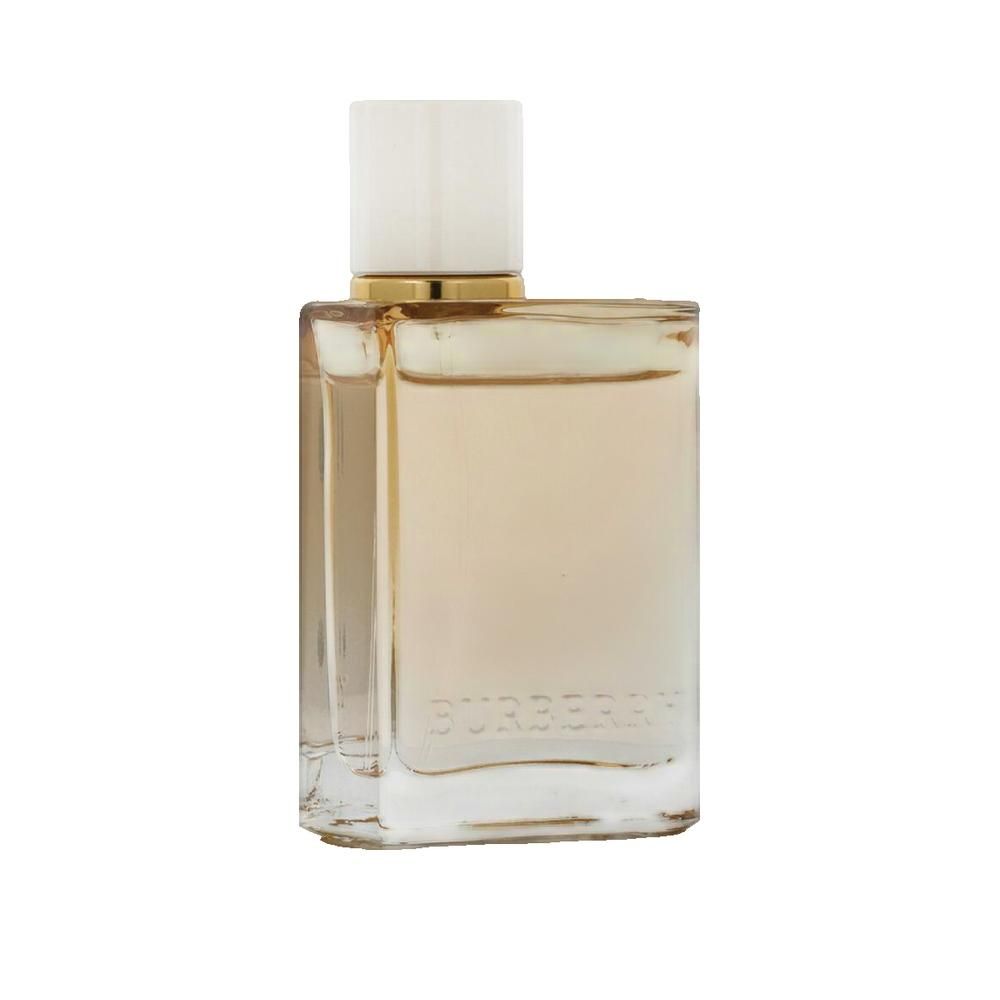 Flacon carré en verre avec liquide beige et bouchon clair. Anneau doré au col.