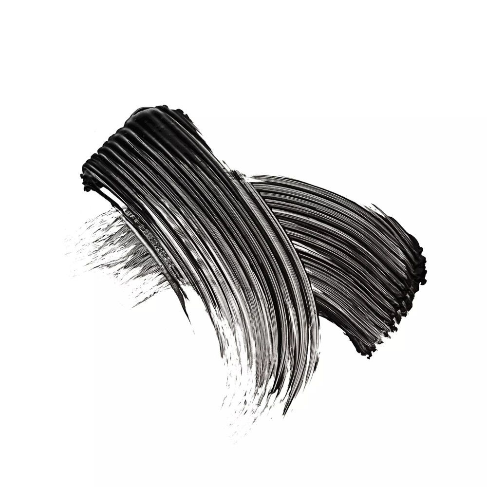 Deux traits de mascara noir sur fond blanc. Texture visible.