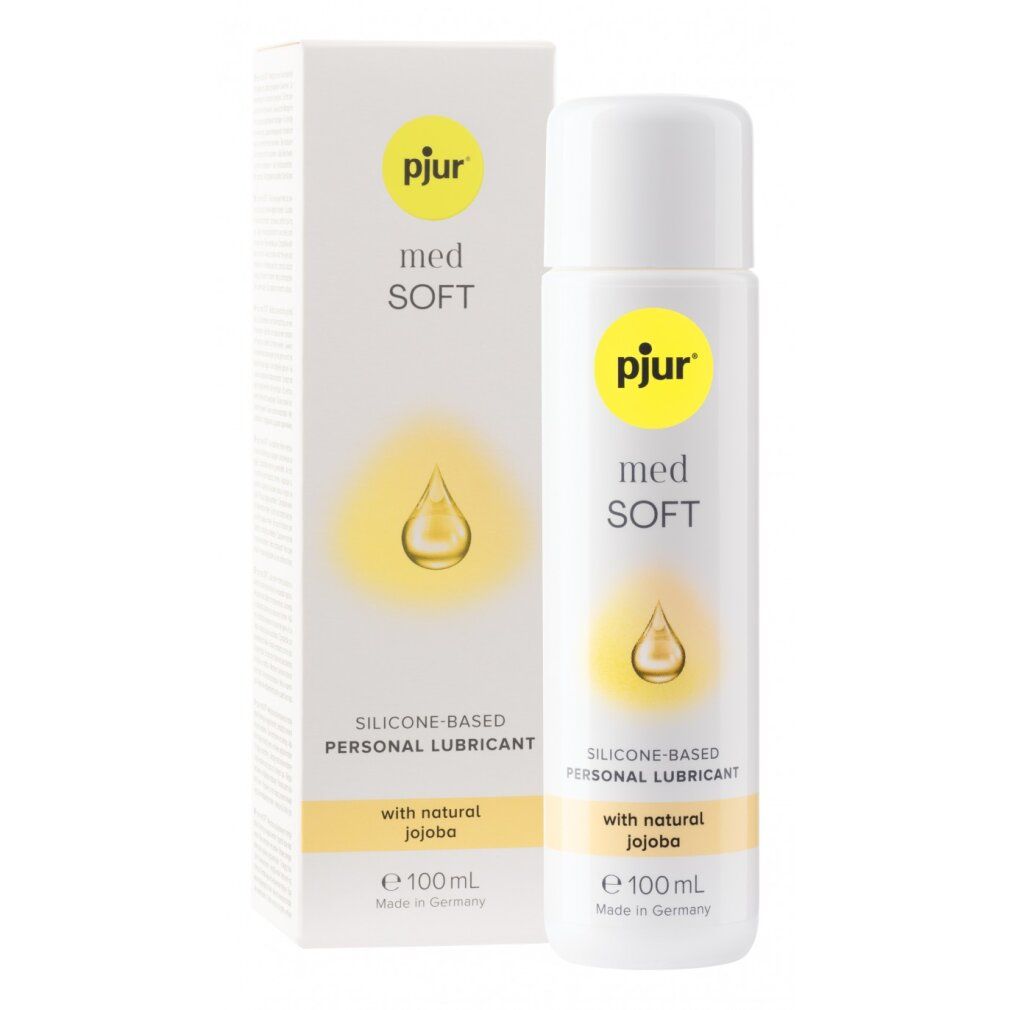 Fles en verpakking van pjur® med *Soft*. Opschrift: Silicone-based Personal Lubricant with natural Jojoba. E 100 ml.