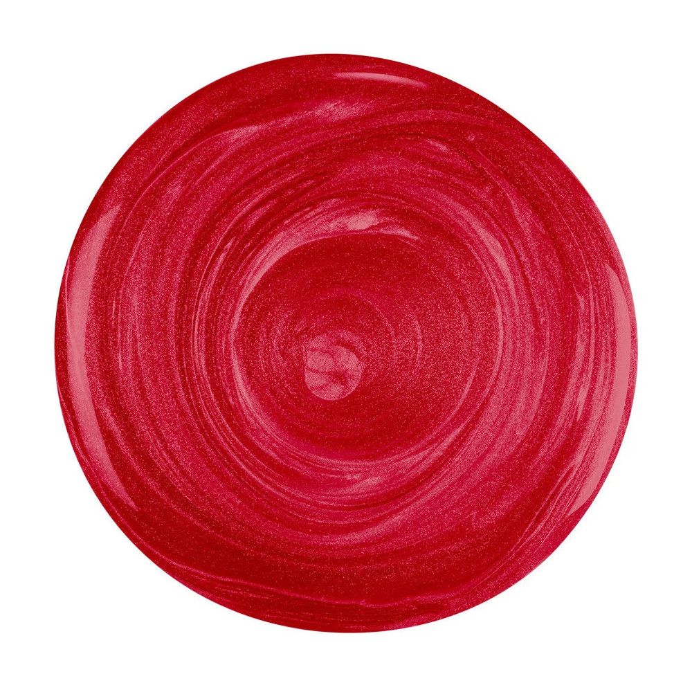 Tache de vernis à ongles rouge en forme circulaire. Le vernis a un effet brillant.