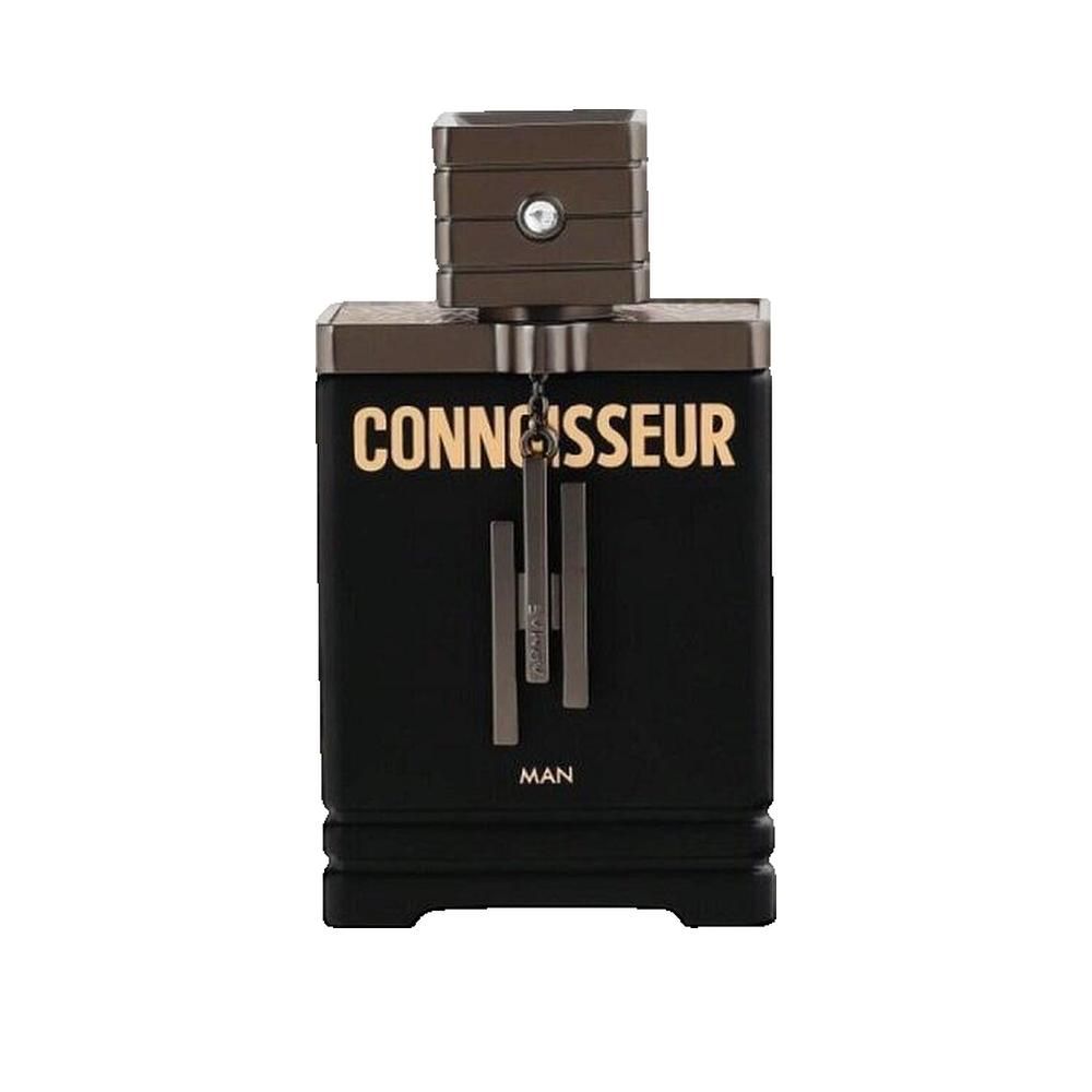 Flacon noir avec inscription dorée « CONNOISSEUR MAN ». Forme rectangulaire, bouchon métallique.
