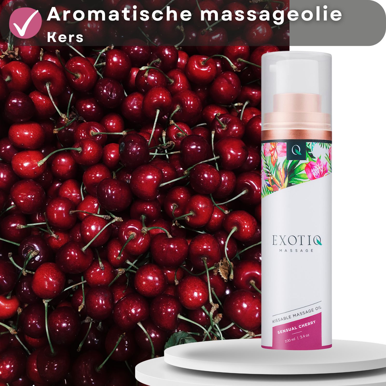 Massageolie fles naast kersen. Tekst: Aromatische massageolie kers.