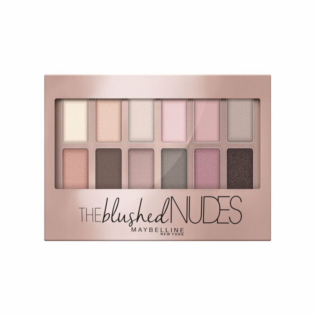 Palette de fards à paupières avec 12 teintes. Emballage rose doré. Inscription : THE blushed NUDES, MAYBELLINE NEW YORK.