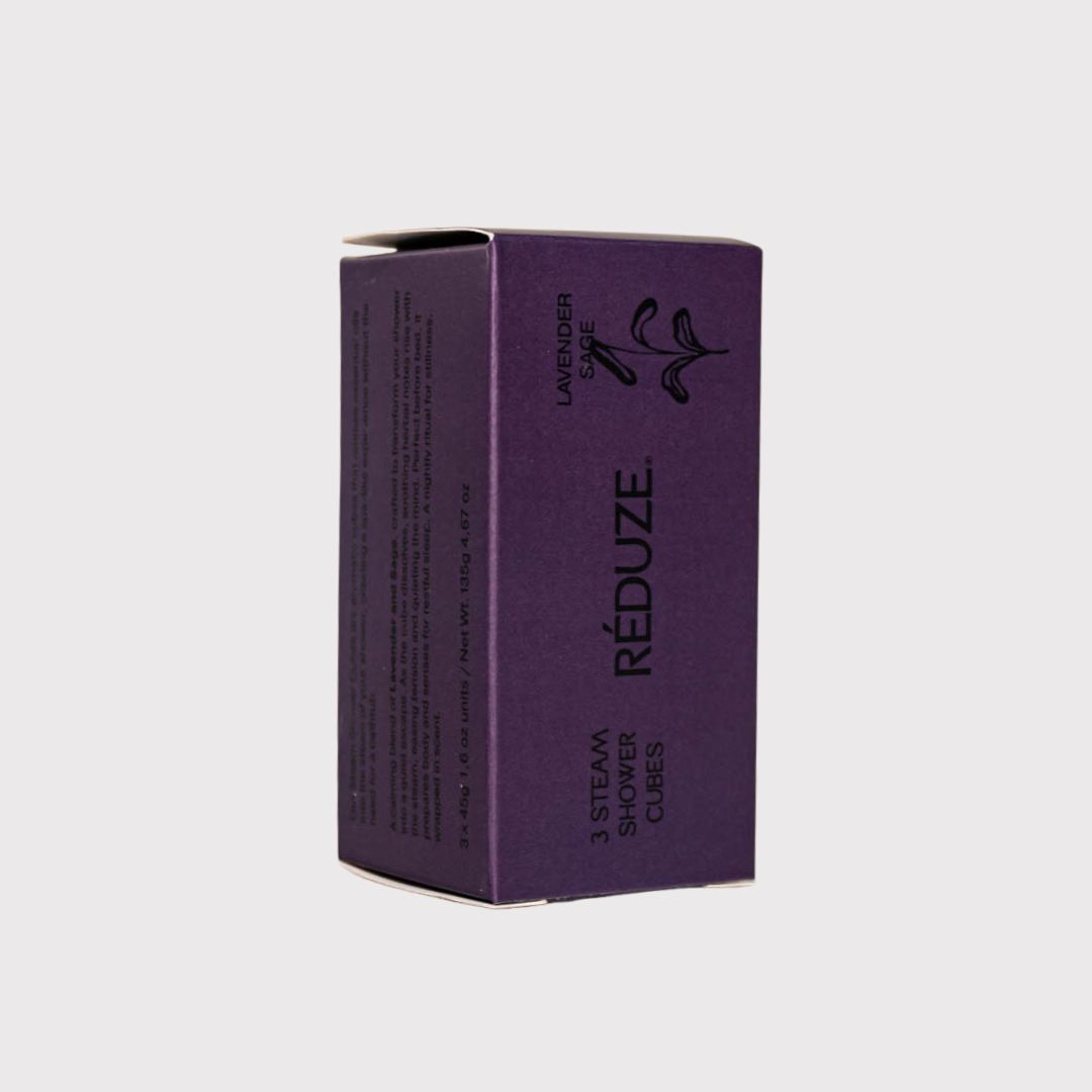 Paarse doos met RÉDUZE-logo en tekst. Opschrift: 3 Steam Shower Cubes.