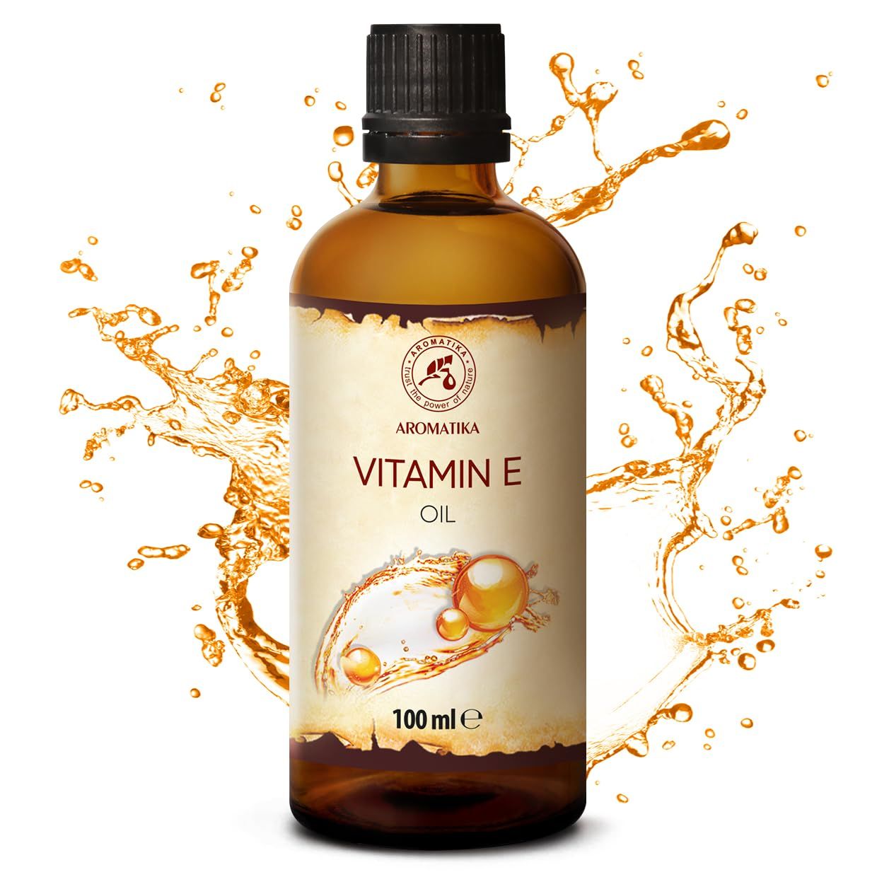 AROMATIKA Vitamine E Olie in bruine glazen fles, omringd door oliespatten. Etiket met druppelmotief.