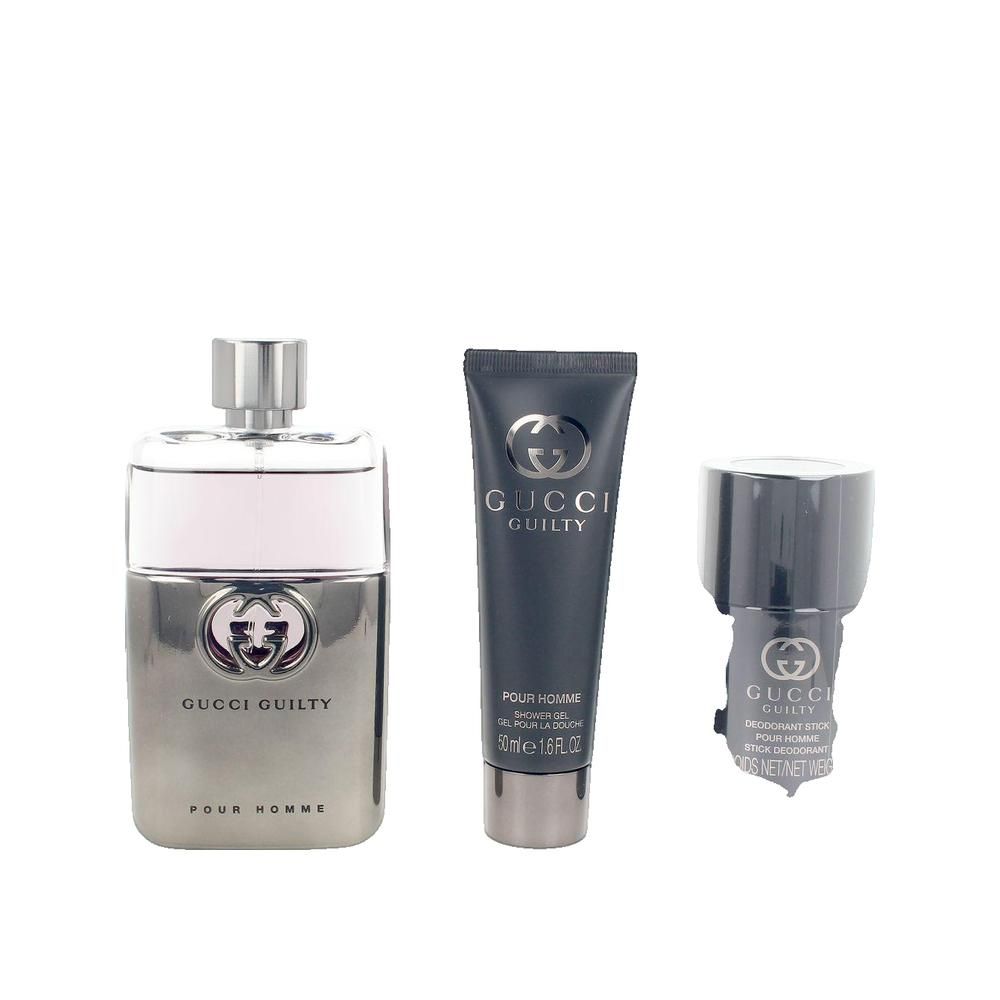 Ensemble de trois produits cosmétiques : flacon, tube et stick déodorant. Tous avec le logo et l'inscription Gucci Guilty Pour Homme.