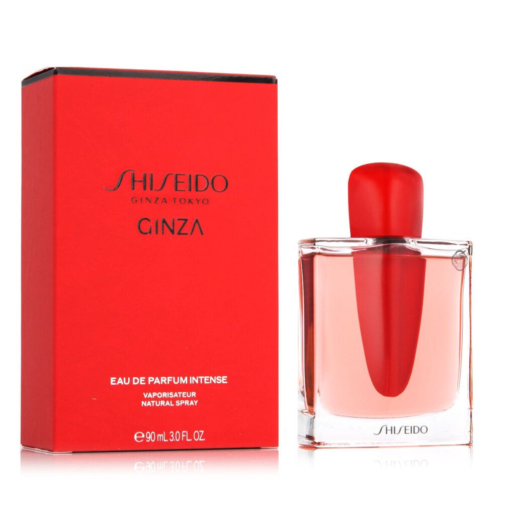 Rode doos en fles. Fles met rode dop, transparant glas en rode vloeistof. Opschrift: Shiseido Ginza.