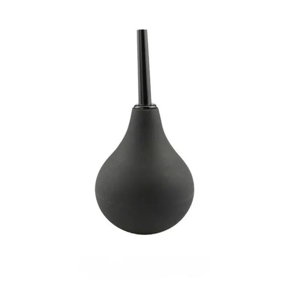 Dispositif en forme de poire, avec une poire en caoutchouc noir et un applicateur noir. Sur fond blanc.