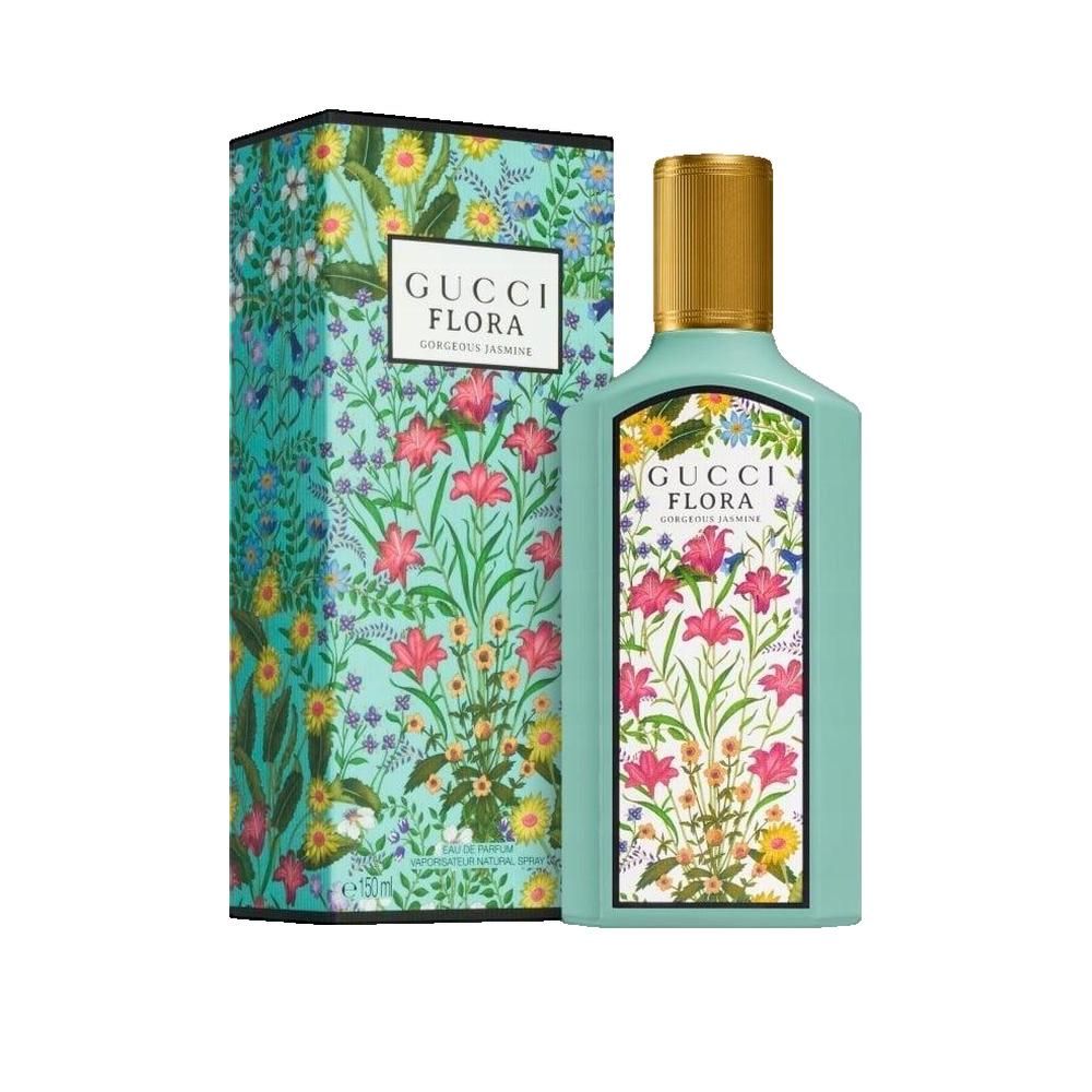 Flacon turquoise et boîte à motifs floraux. Inscription Gucci Flora Gorgeous Jasmine. Bouchon doré.