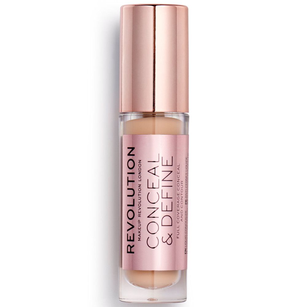 Flacon de correcteur avec bouchon rose doré. Nom du produit et marque visibles. Sur fond blanc.