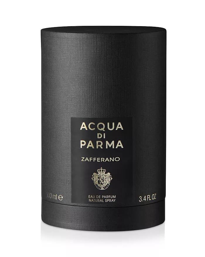 Zwarte cilindrische verpakking met etiket. Opschrift: ACQUA DI PARMA Zafferano. Onder: 100 ml, 3.4 FL.OZ.