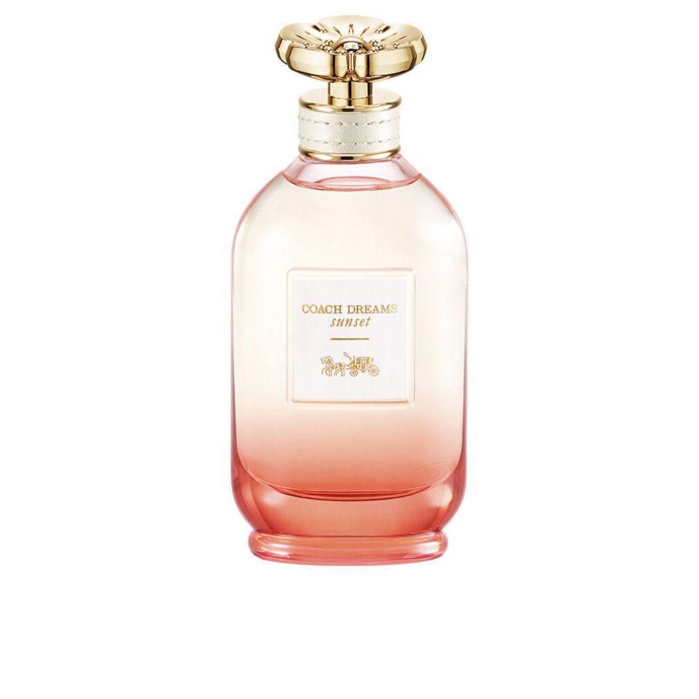 Flacon de parfum avec bouchon doré. Inscription: Coach Dreams Sunset. Dégradé de rose à orange.