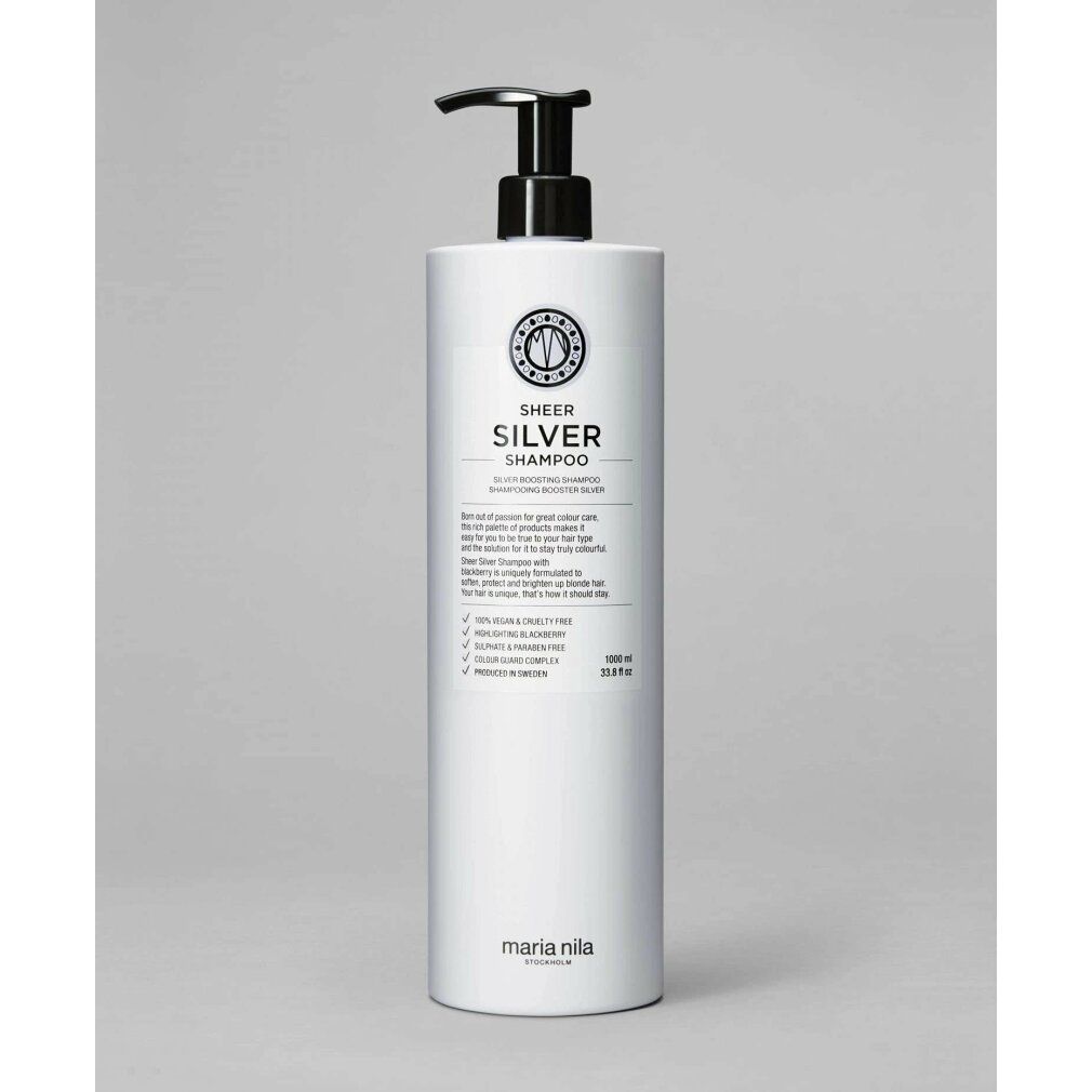 Flacon blanc avec pompe, étiqueté 'SHEER SILVER SHAMPOO' et 'MARIA NILA'.