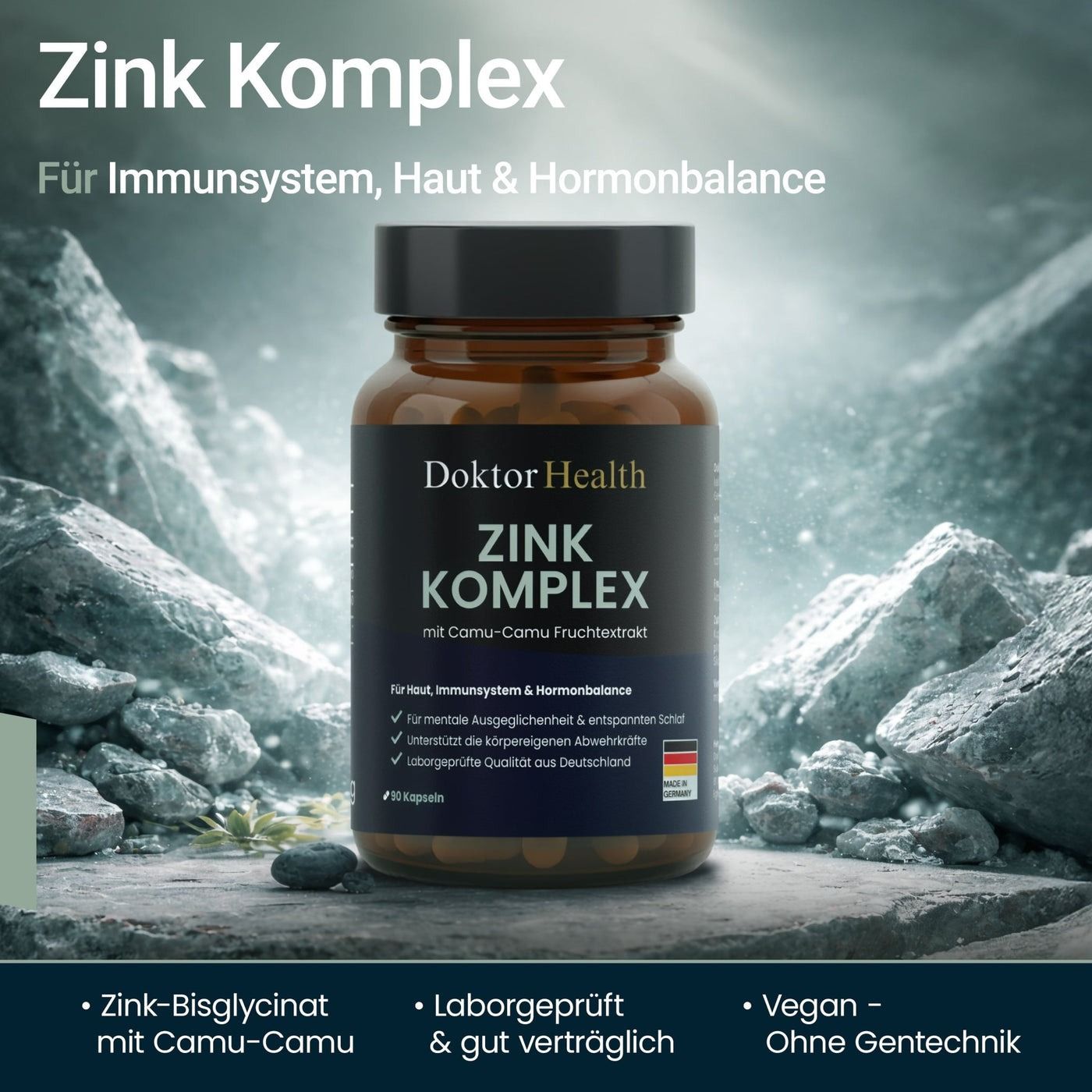 Bruine glazen fles met zwarte dop. Opschrift: Doktor Health Zink Komplex. Capsules. Achtergrond: rotsen. Tekst: Voor immuunsysteem, huid & hormonale balans.