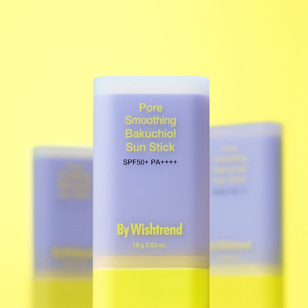 Stick solaire violet et jaune. Texte : Pore Smoothing Bakuchiol Sun Stick, SPF50+ PA++++, By Wishtrend. 18 g 0.63 oz.