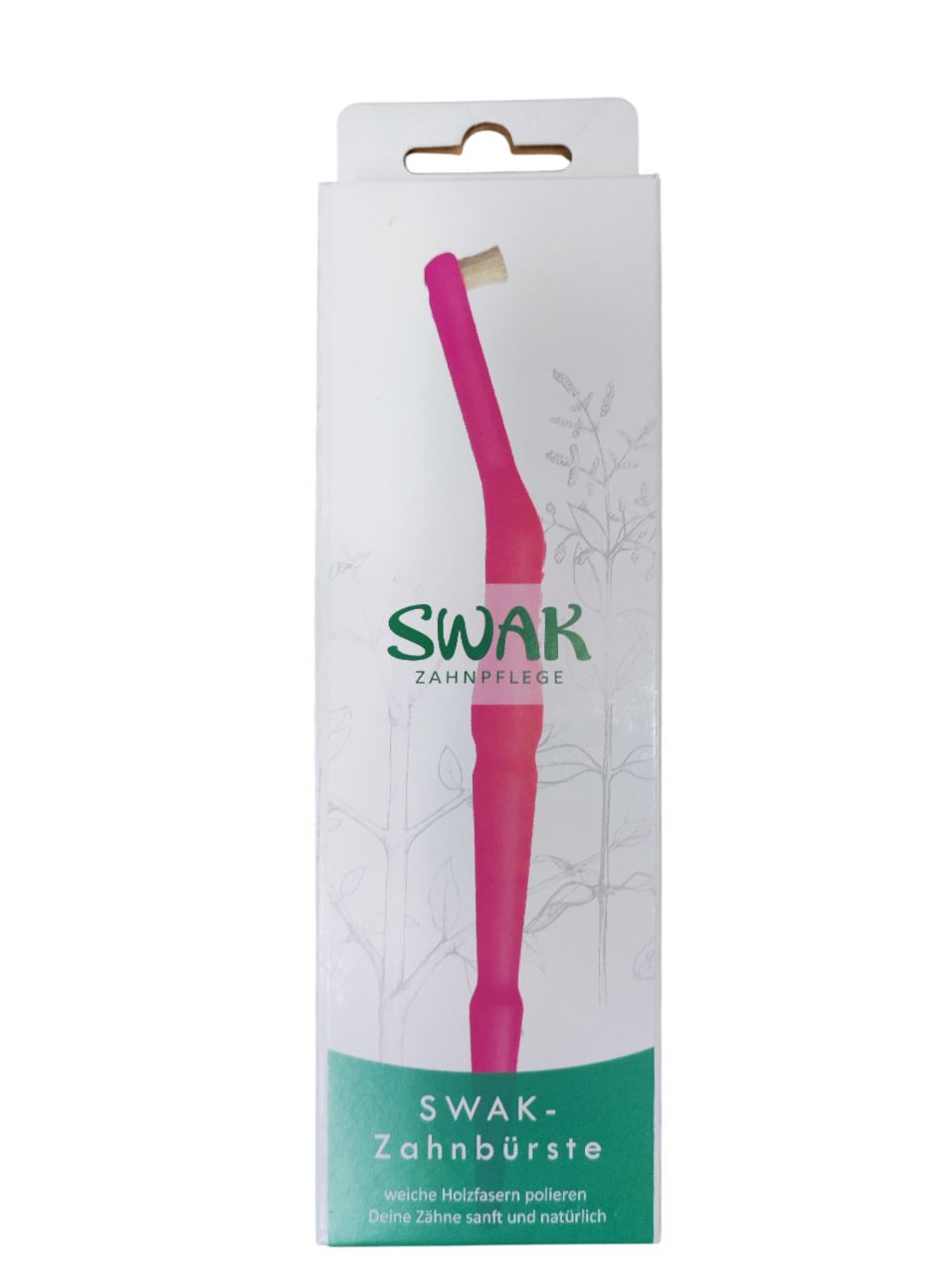 Brosse à dents dans son emballage. L'emballage porte l'inscription SWAK-Zahnpflege.