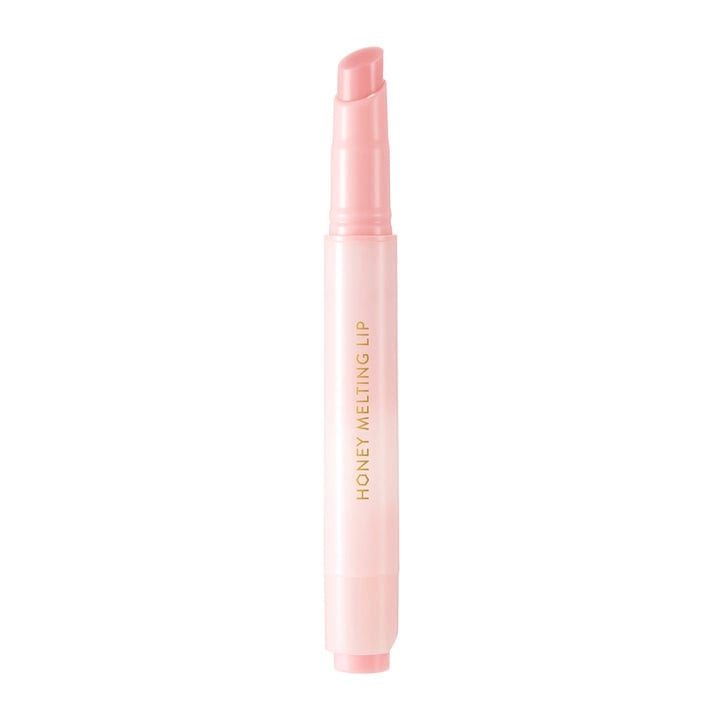Bâton de gloss rose. Inscription : "HONEY MELTING LIP".