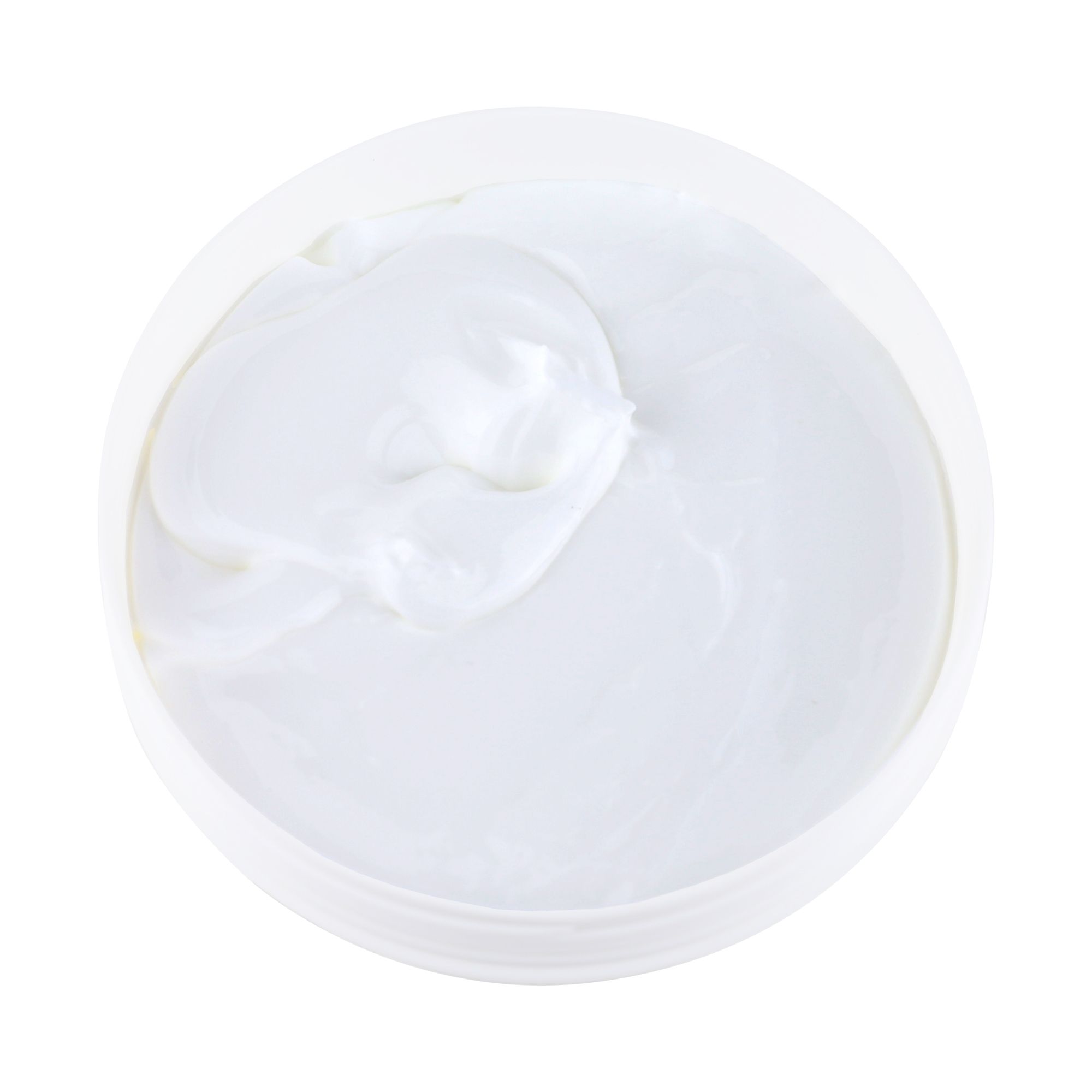 Crème blanche dans un récipient rond, vue de dessus.