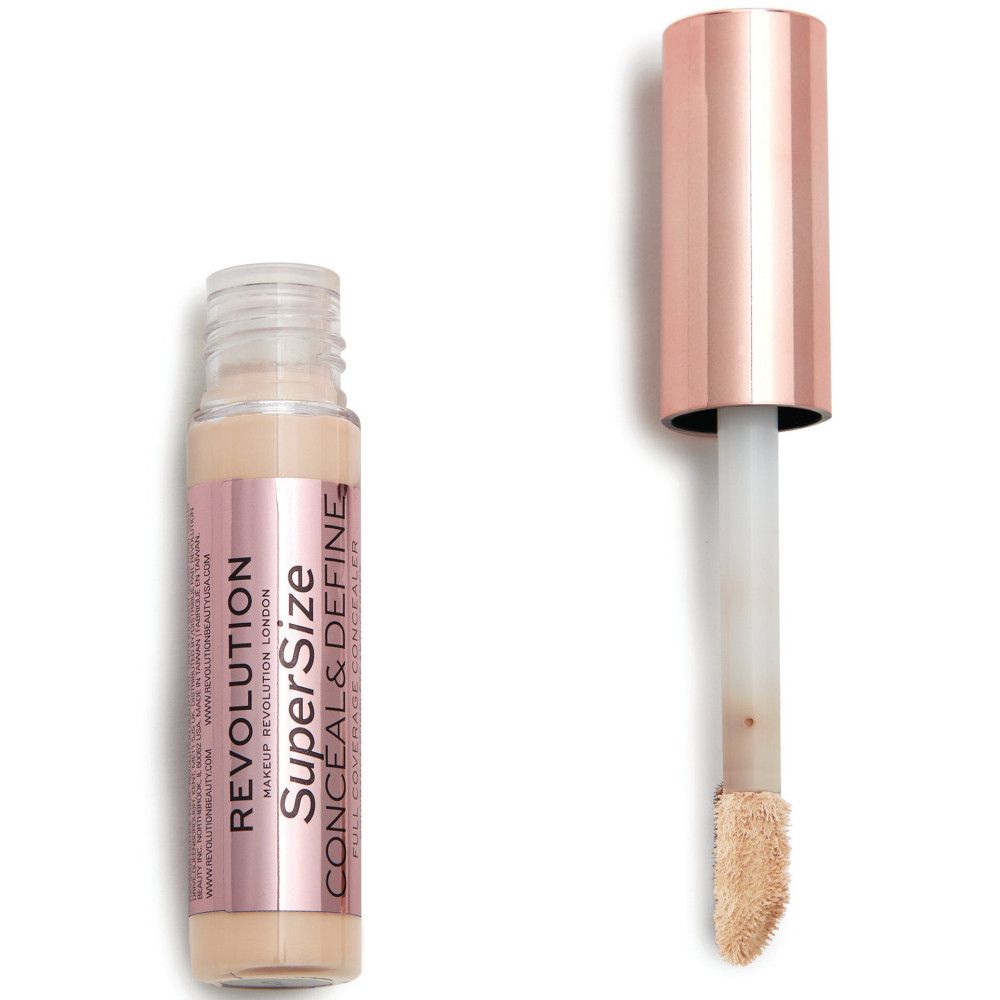 Flacon de correcteur avec applicateur. Bouchon or rose, flacon transparent, produit visible.