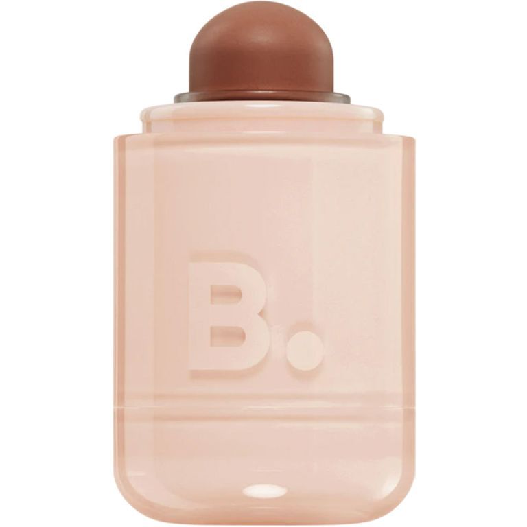 Un récipient cylindrique avec un applicateur marron et le logo en relief 'B.'.