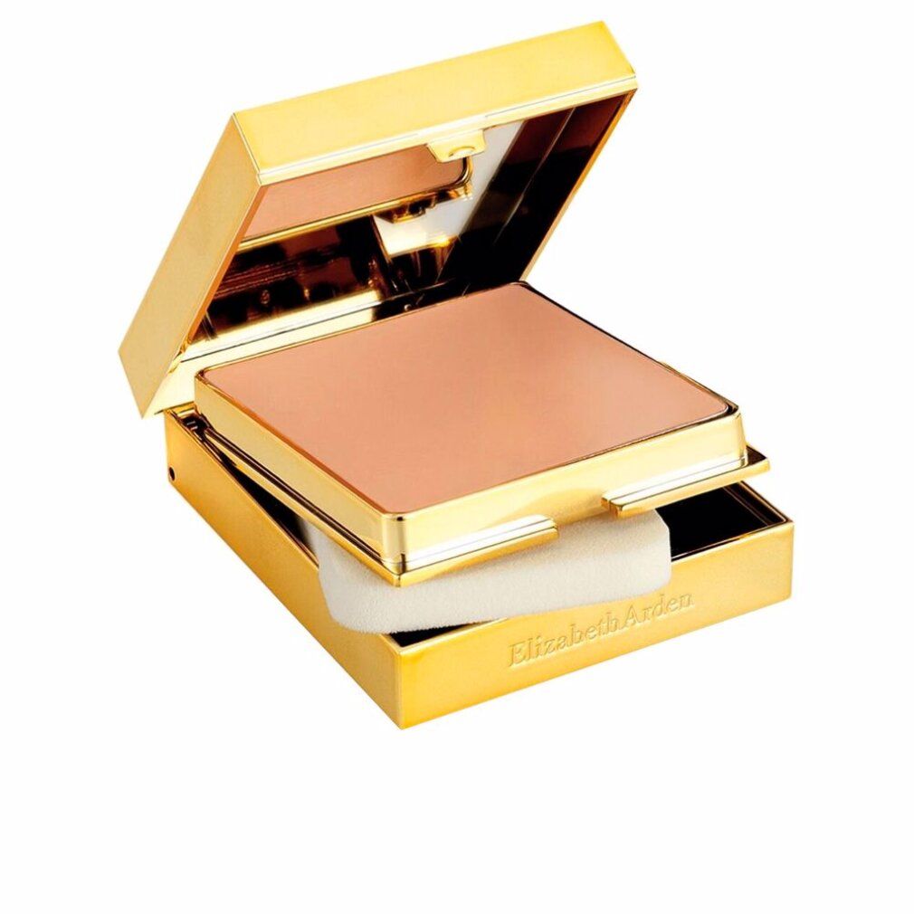 Gouden compacte make-up verpakking met spiegel en spons. Deksel open, toont lichte poeder.