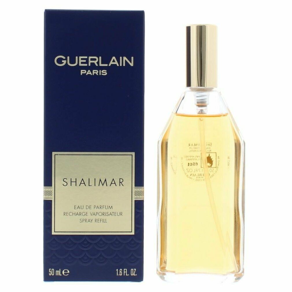 Boîte bleue foncée et flacon. GUERLAIN PARIS et SHALIMAR sur la boîte. Flacon transparent avec bouchon doré.