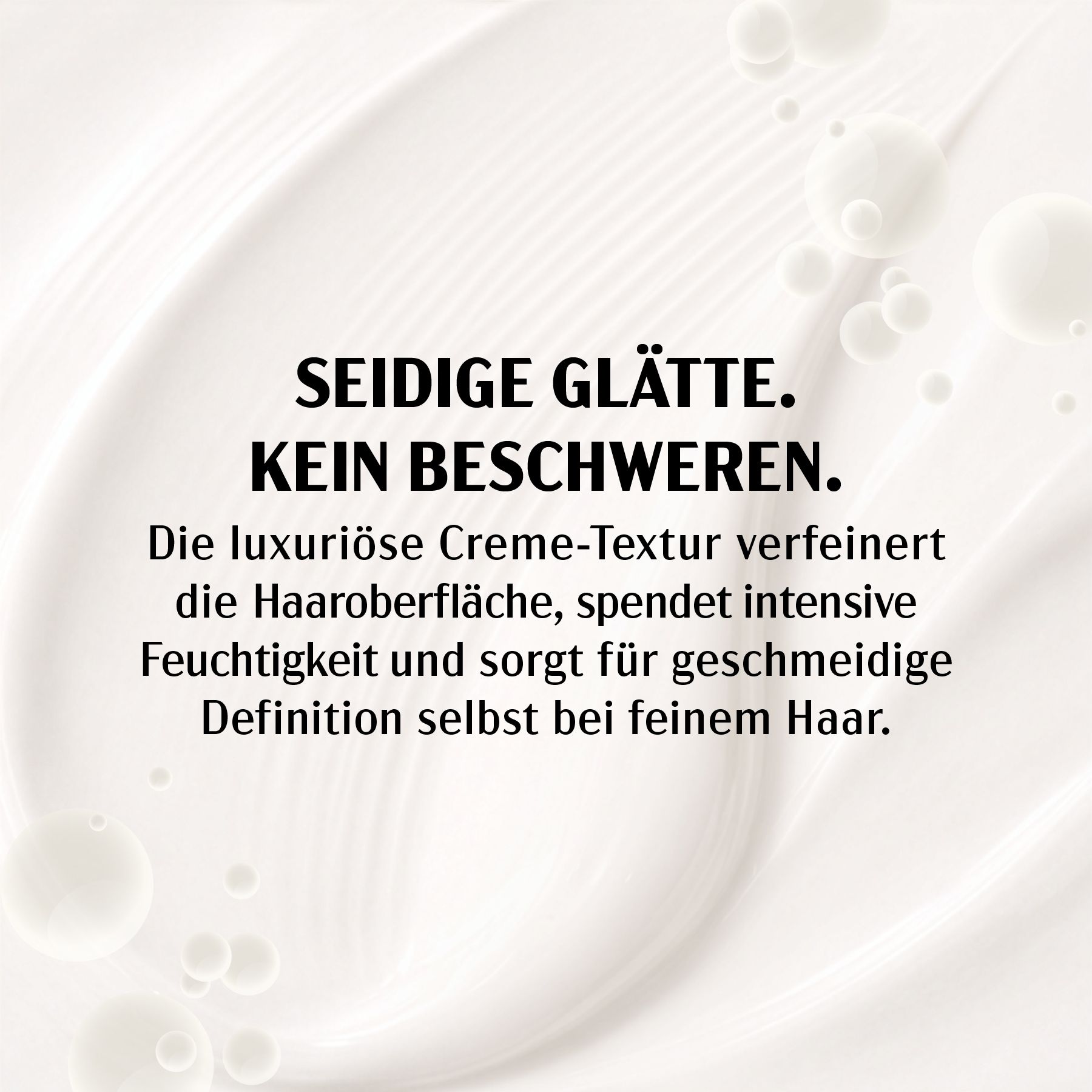 Close-up van crème. Tekst: Zijdezacht glad. Verzwaart niet. Luxe crème textuur voor soepel haar.