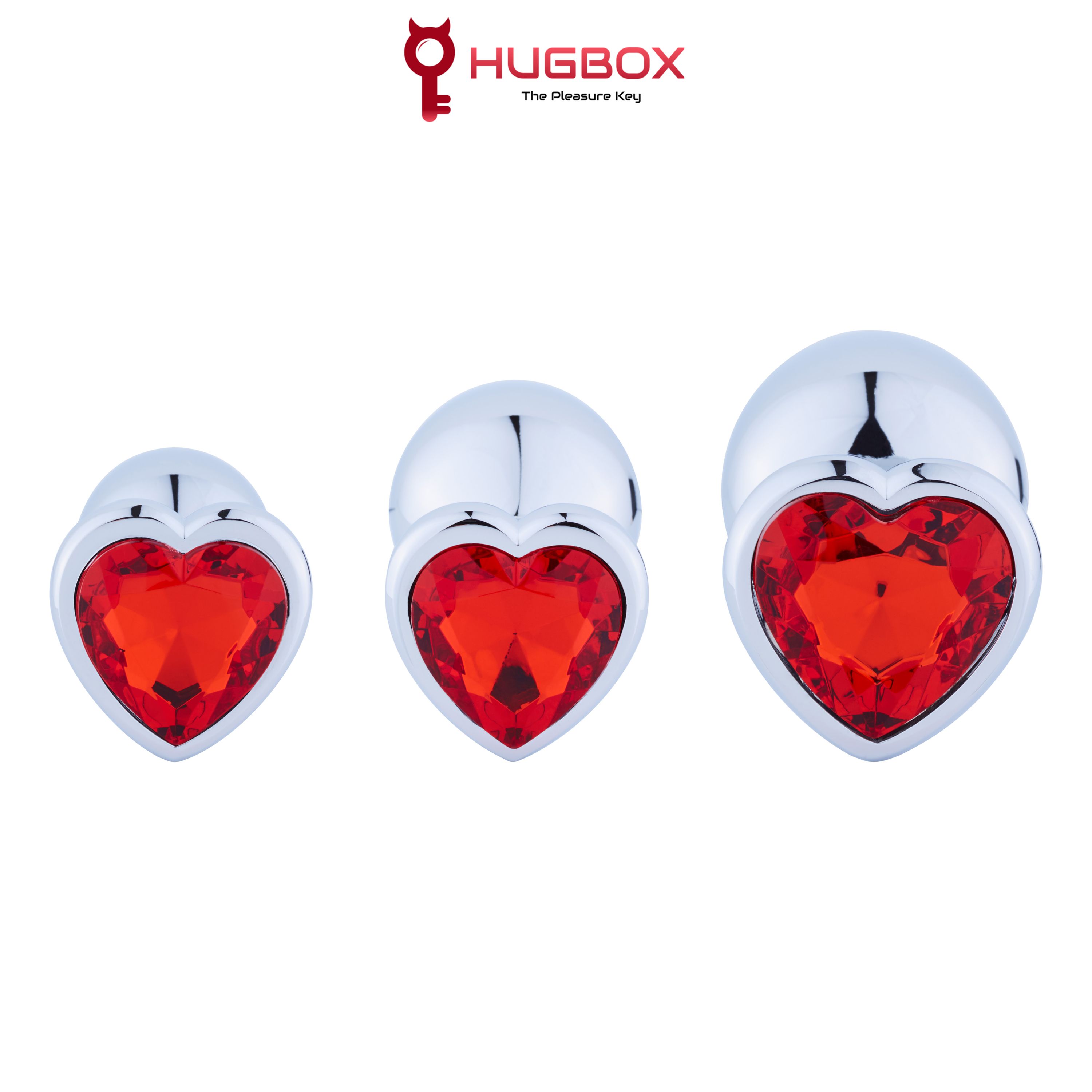 Trois plugs anaux avec cristaux rouges en forme de cœur. Différentes tailles, brillant.