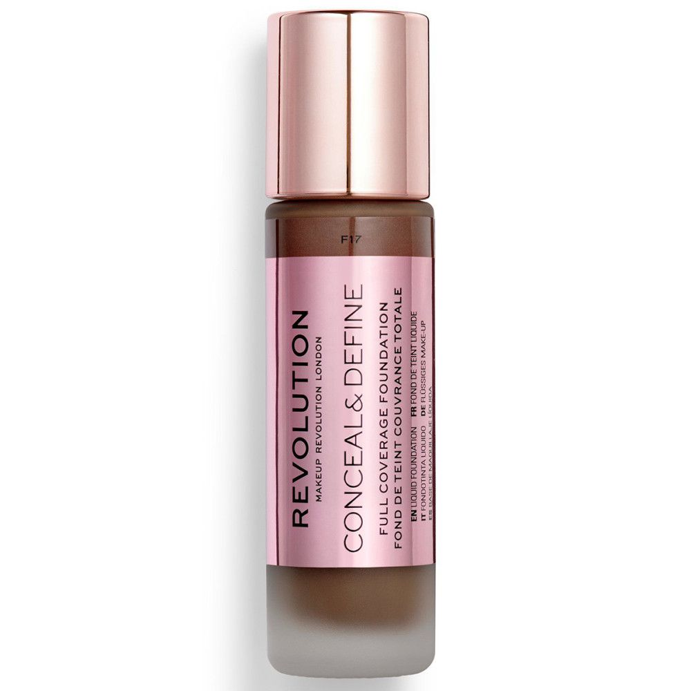 Foundationfles met roségouden dop. Roze etiket met productnaam en merk. Donkerbruine foundation zichtbaar.