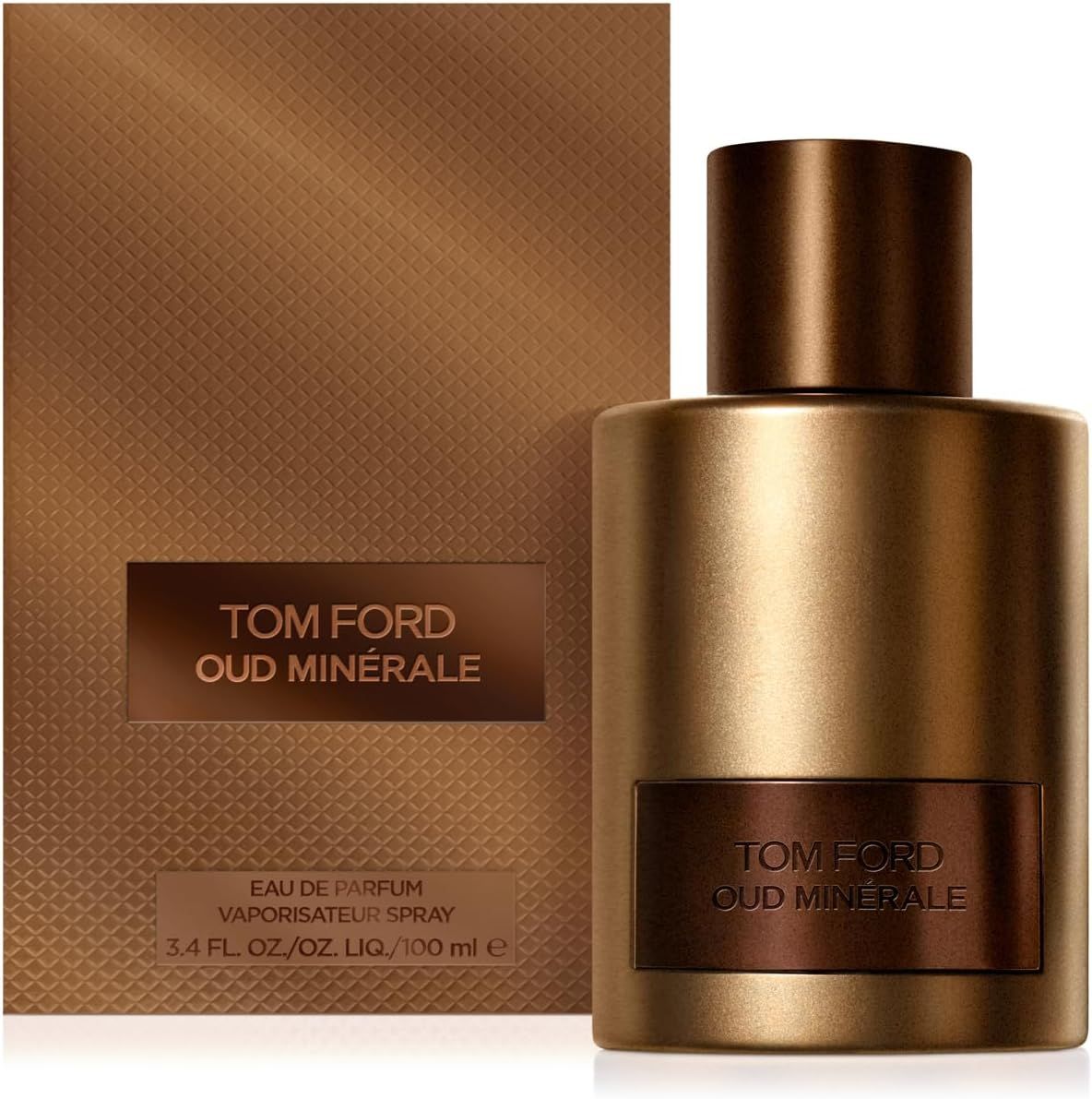 Gouden fles, bruine dop, rechthoekig etiket. Bruine verpakking met tekst TOM FORD OUD MINERALE.