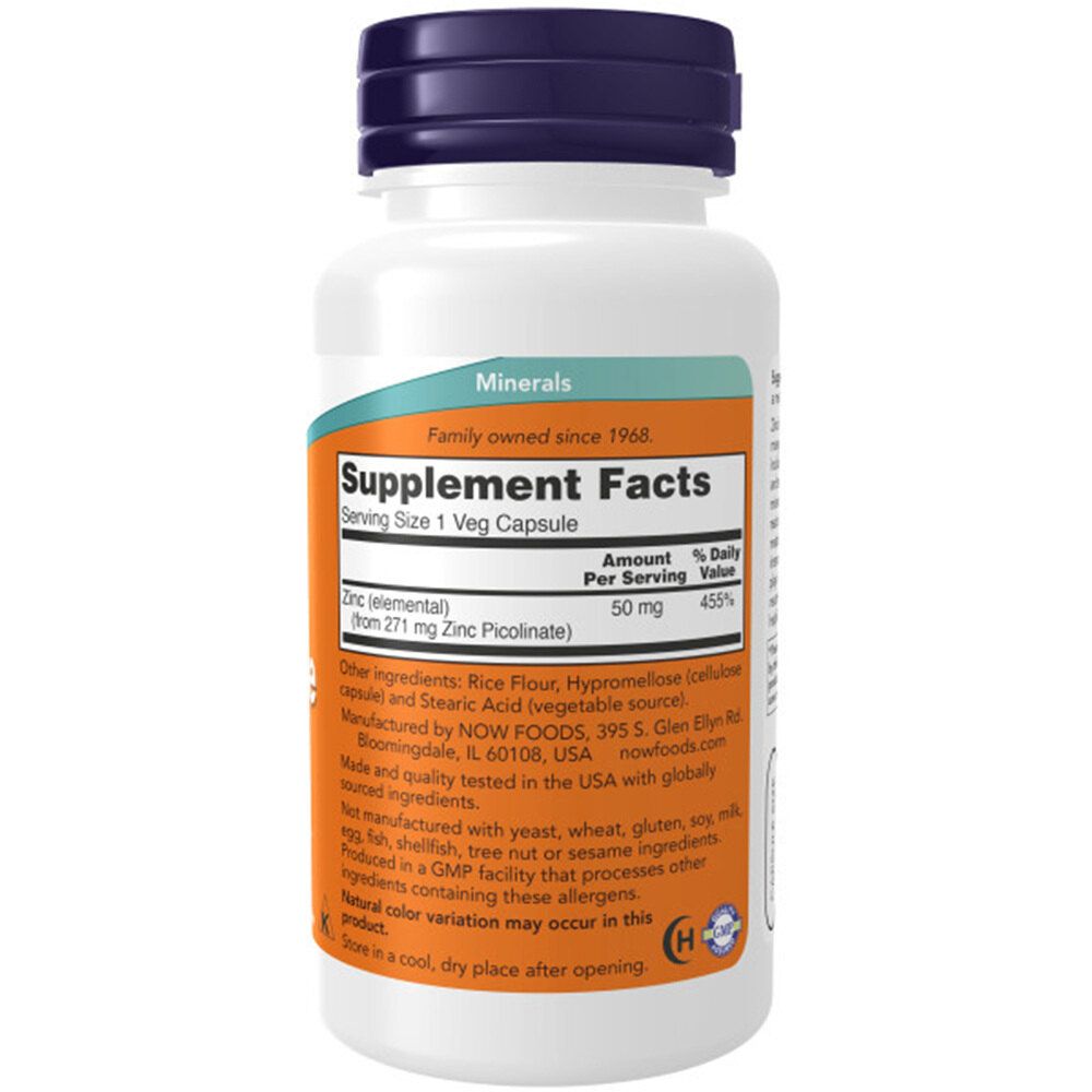 Dos du flacon. Étiquette avec informations nutritionnelles, ingrédients et fabricant. Fond blanc.