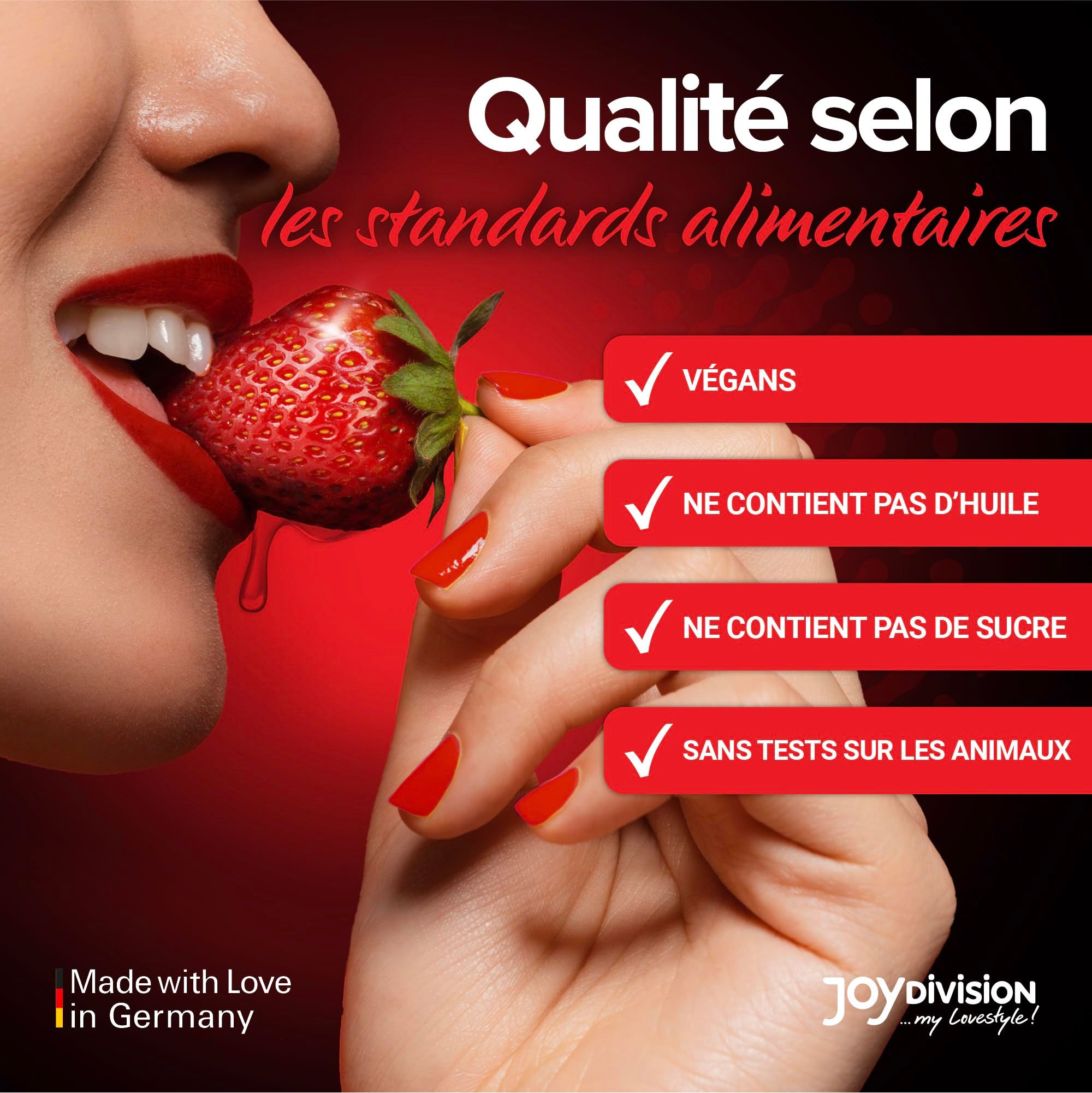 Bouteille d'huile de massage rouge avec imprimé fraise et fraises.